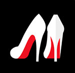 A pair of white heeled shoes with a red back to them The answer is: Christian Louboutin