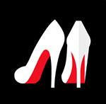 A pair of white heeled shoes with a red back to them  The answer is: Christian Louboutin