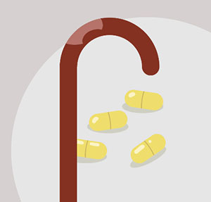 A brown cane with four yellow pills on a white plate