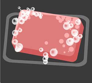 A red bar of soap with bubbles. 